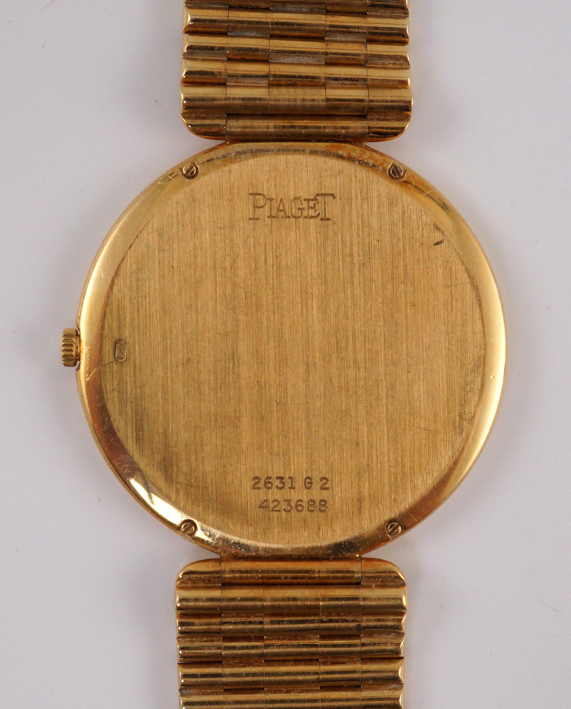 A gentleman's 18ct gold Piaget manual wind dress wrist watch, on an 18ct gold Piaget bracelet